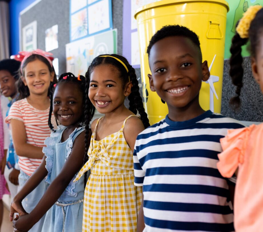 Portrait of happy diverse children in ecology class at elementary school